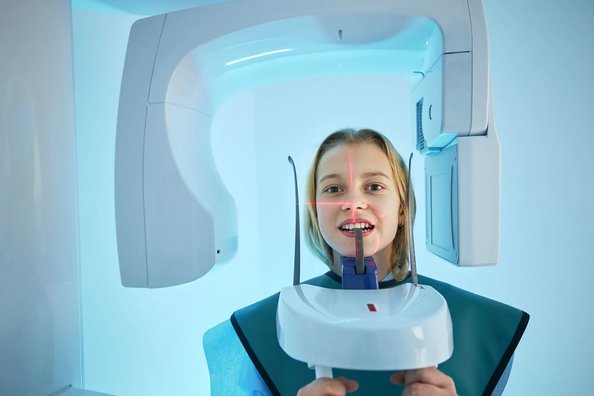 Modern dental surgery. Girl in clinic getting x-ray of teeth.